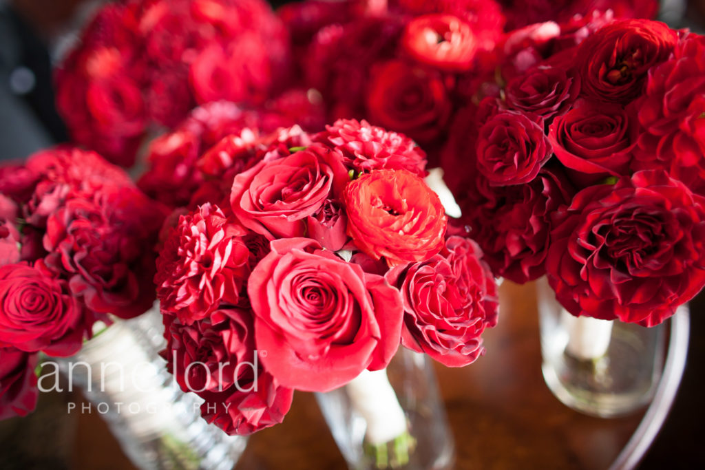 red bridesmaids bouquets